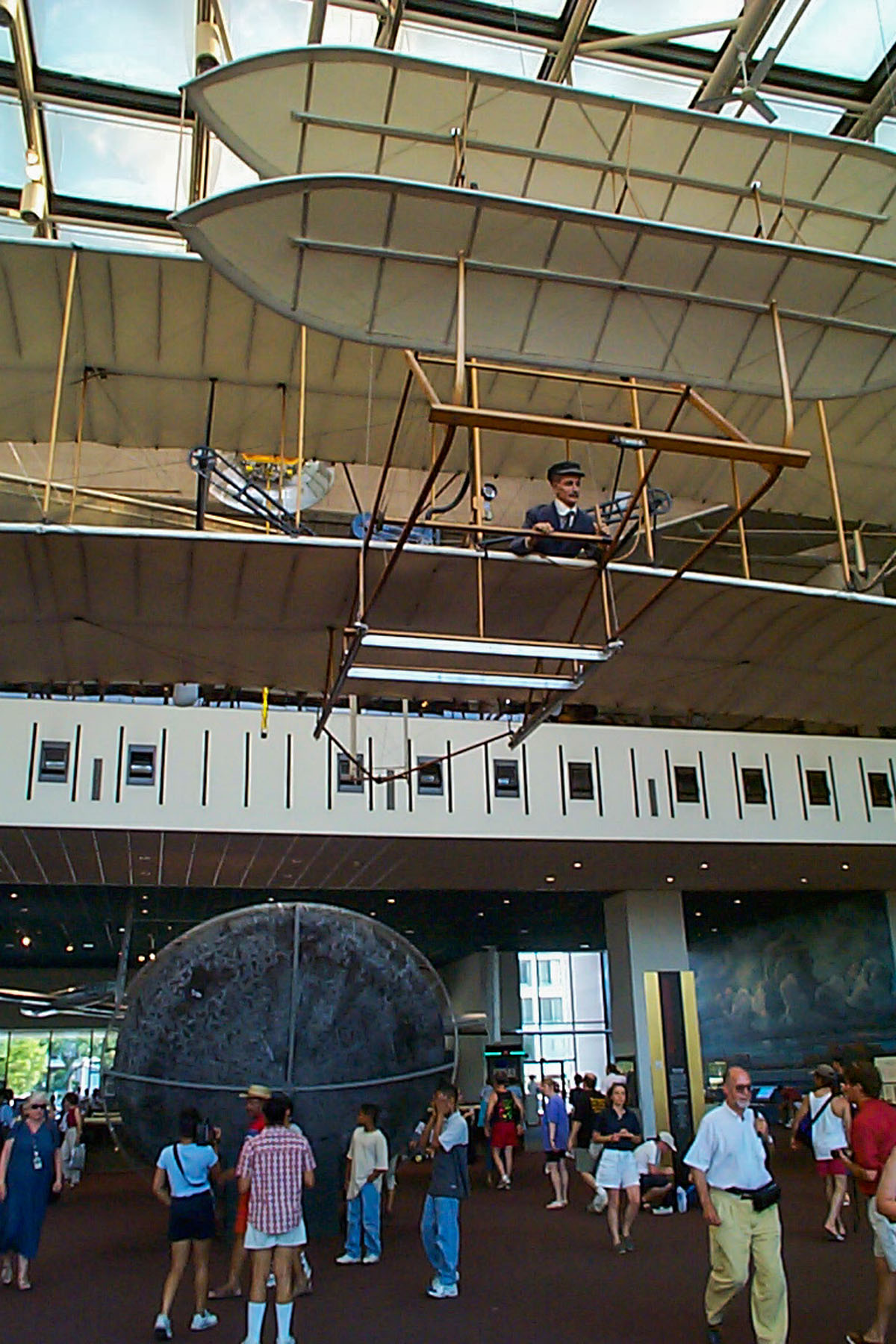 1903 Wright Flyer above Apollo 11 command capsule Columbia, National Air and Space Museum, Washington.  Click for next photo.