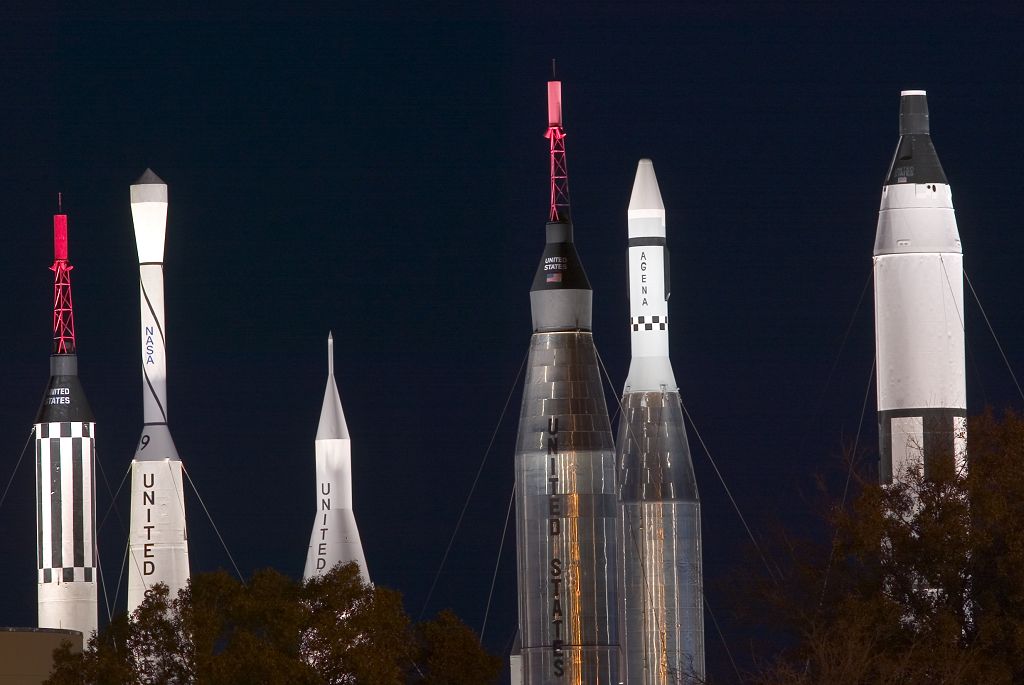 Historic rockets at the Space Center, lit up at night.  Click for next photo.