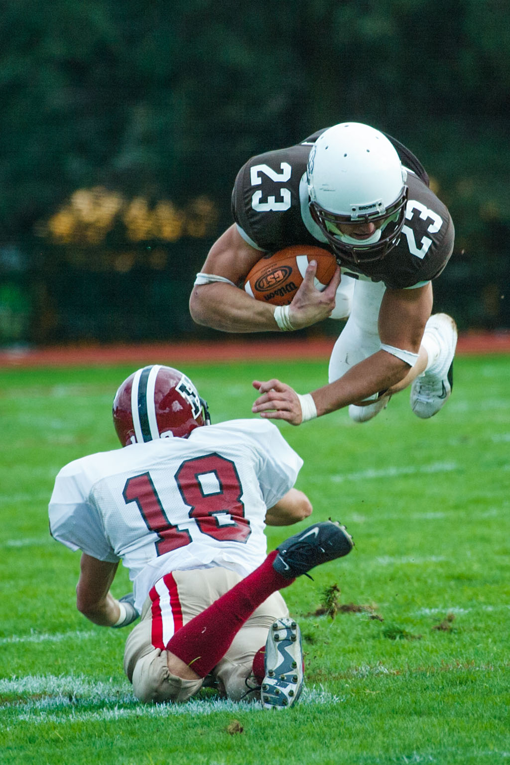 Brown University's Chas Gessner goes flying.  Click for next photo.