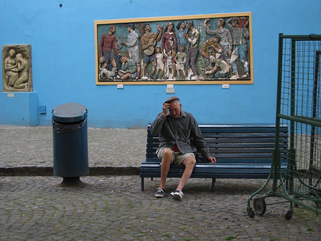 An old man finds a bench, La Boca, Buenos Aires.  Click for next photo.