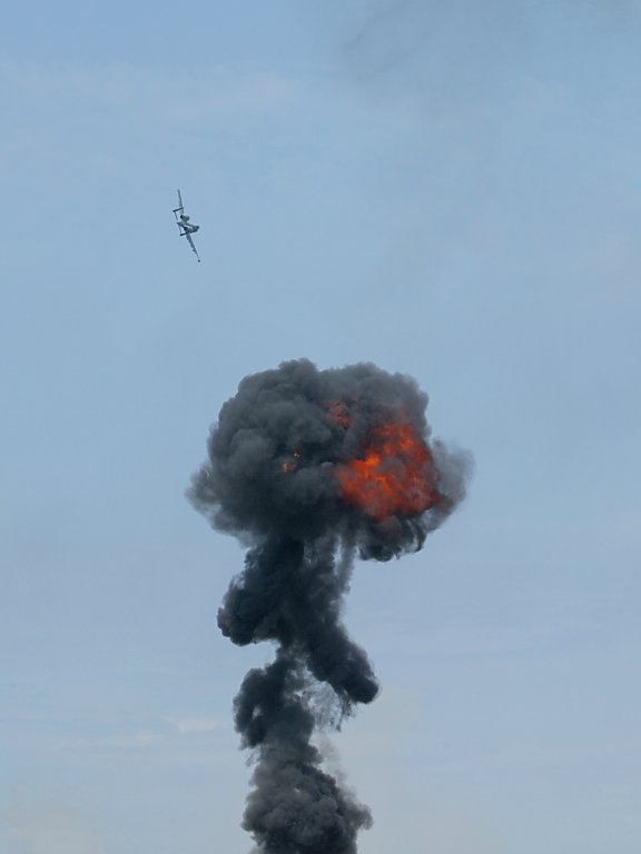 A-10 circles past the pyrotechnics. 100-400mm (115mm), 1/800 at f/8.  Click for next photo.