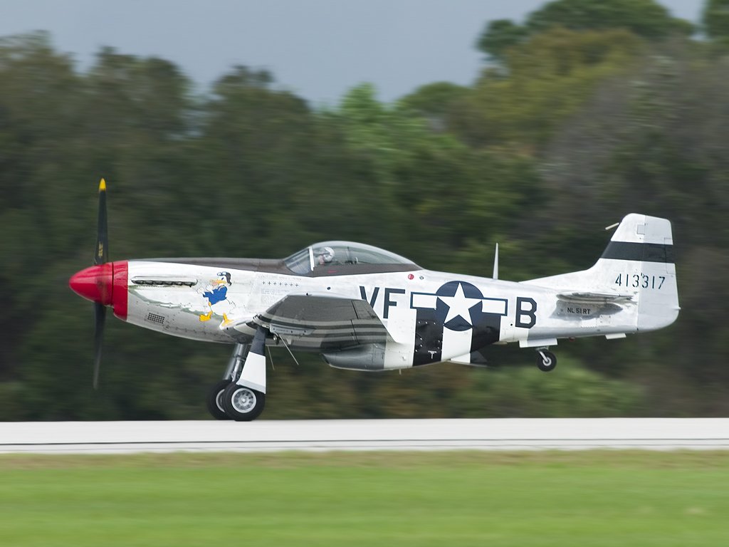 P-51 Mustang Donald Duck takes off.  Florida 2003.  Click for next photo.