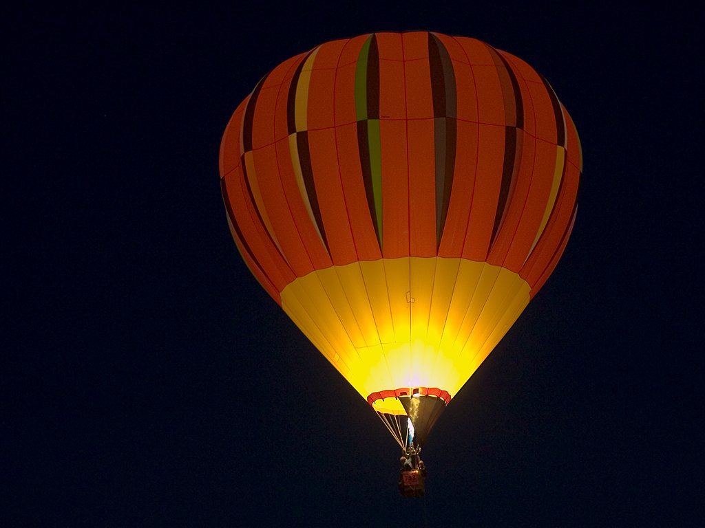 Flame illumunates a balloon, Albuquerque Balloon Fiesta.  Click for next photo.