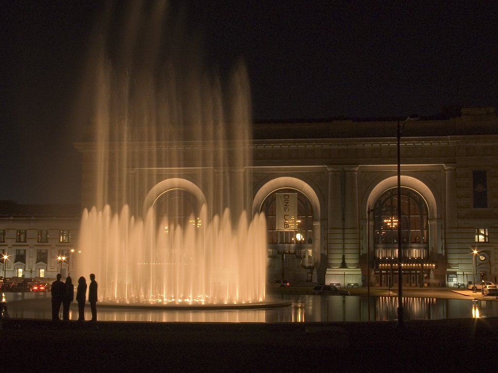 A group watches the fountain in front of Union Station, Kansas City, while waiting for a photographer (not me) to set up a shot.  Click for next photo.