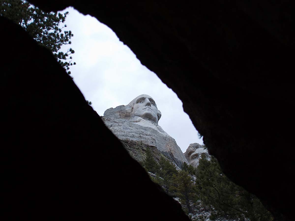 Mt. Rushmore as seen through a gap in the rock, October.    Click for next photo.