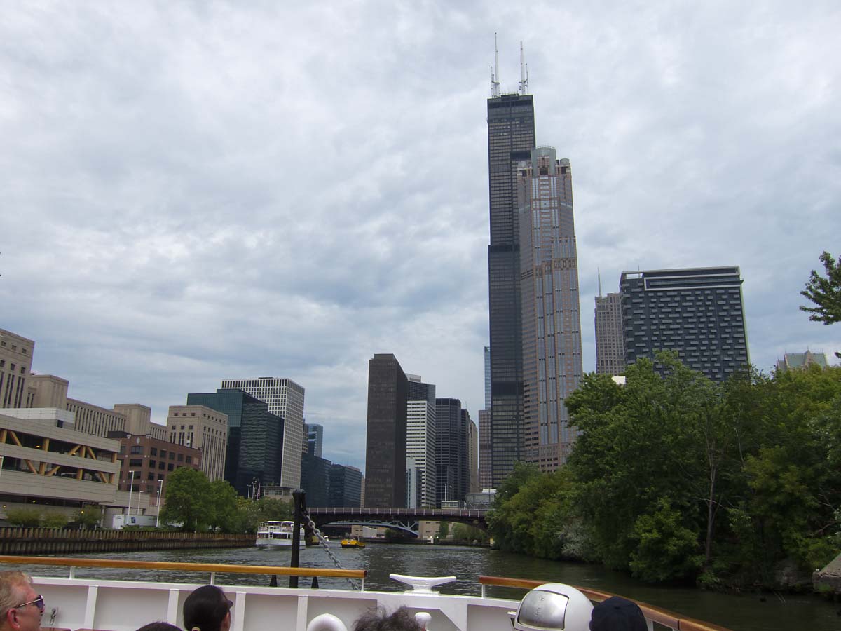 Willis Tower (formerly the Sears Tower), Chicago River boat tour.  For two years (2011-2013) I worked in the building across the river from the tower, the (relatively) tiny 30-story black building to the left of the bridge.  Click for next photo.