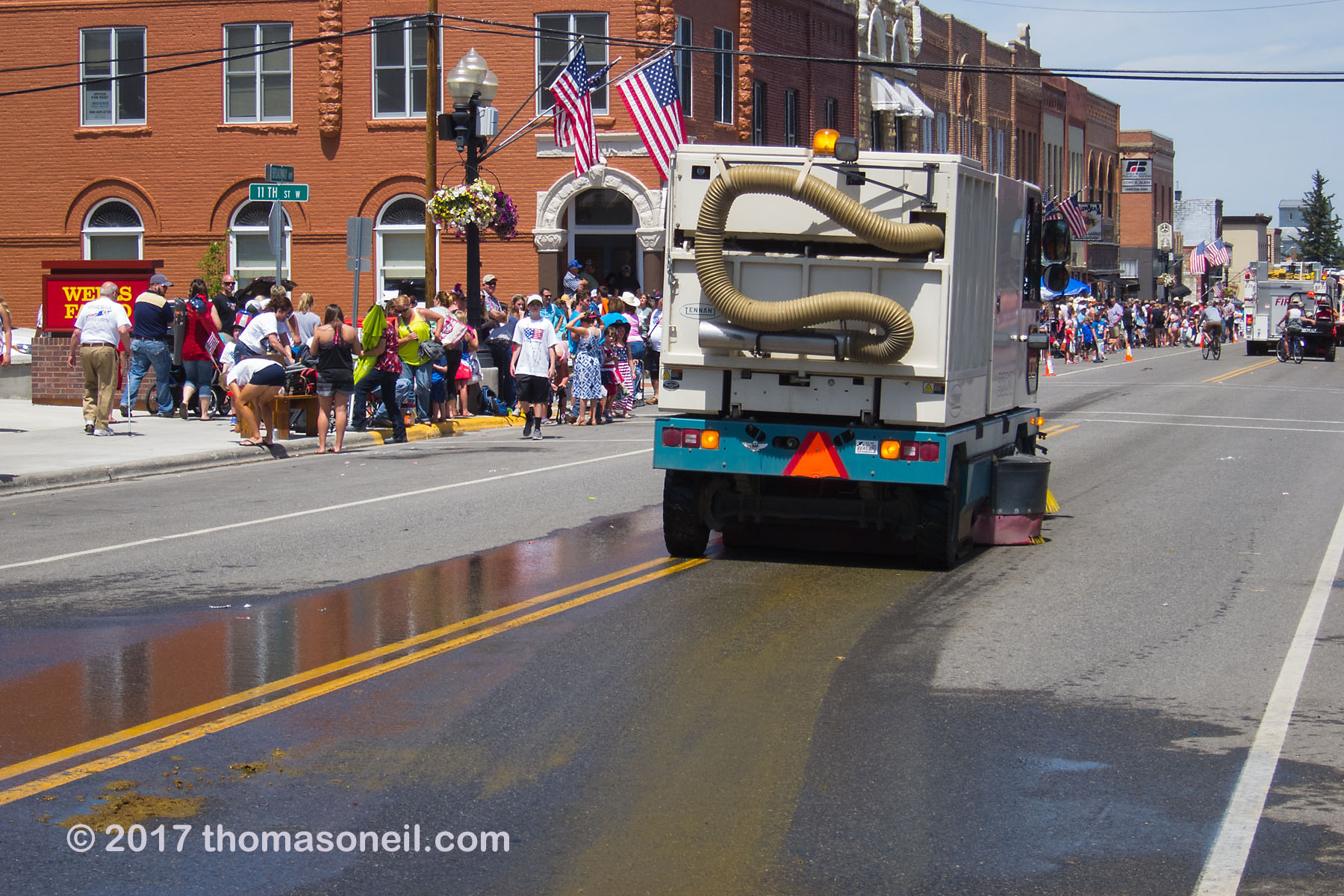 You know the 4th of July parade in Red Lodge, MT is over when the street sweeper comes out to take care of the horse droppings, 2017.  Click for next photo.