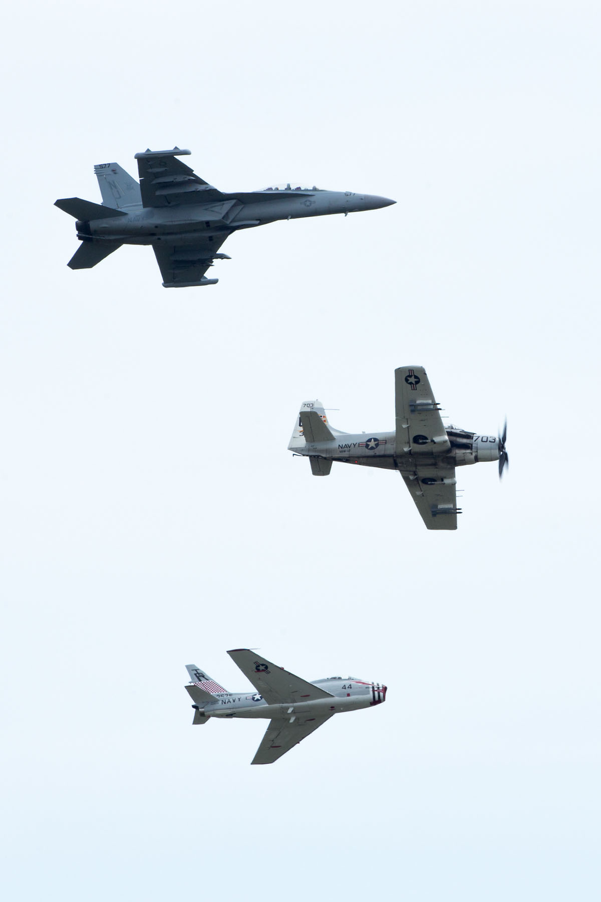 Heritage flight, Sioux Falls Air Show, August 2019.  The flight featured Navy planes (from top) F/A-18 Hornet, AD-4 Skyraider, and FJ-4B Fury.  Click for next photo.
