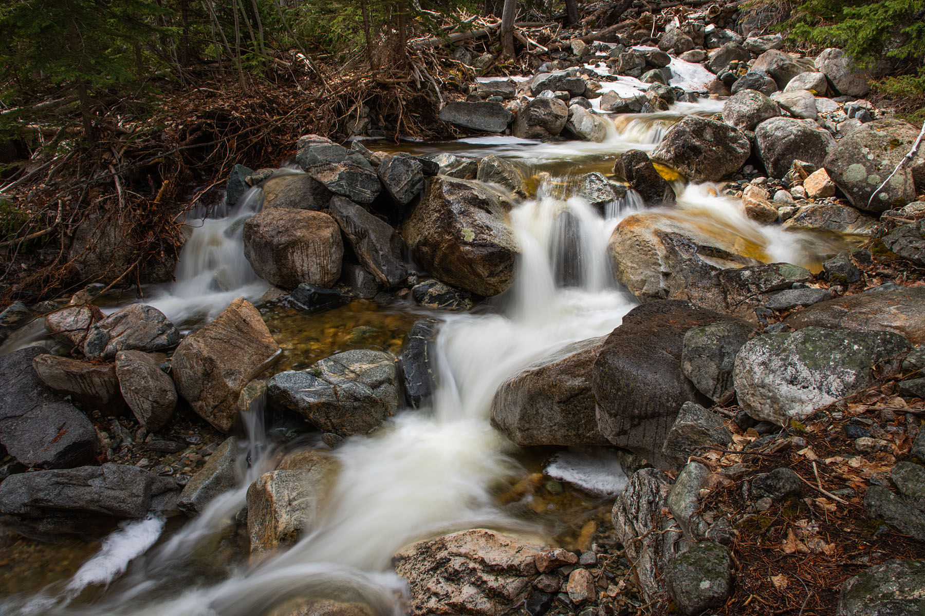 Snow Creek in the national forest,.  Polarizer filter, exposure 1/2 second.  Click for next photo.
