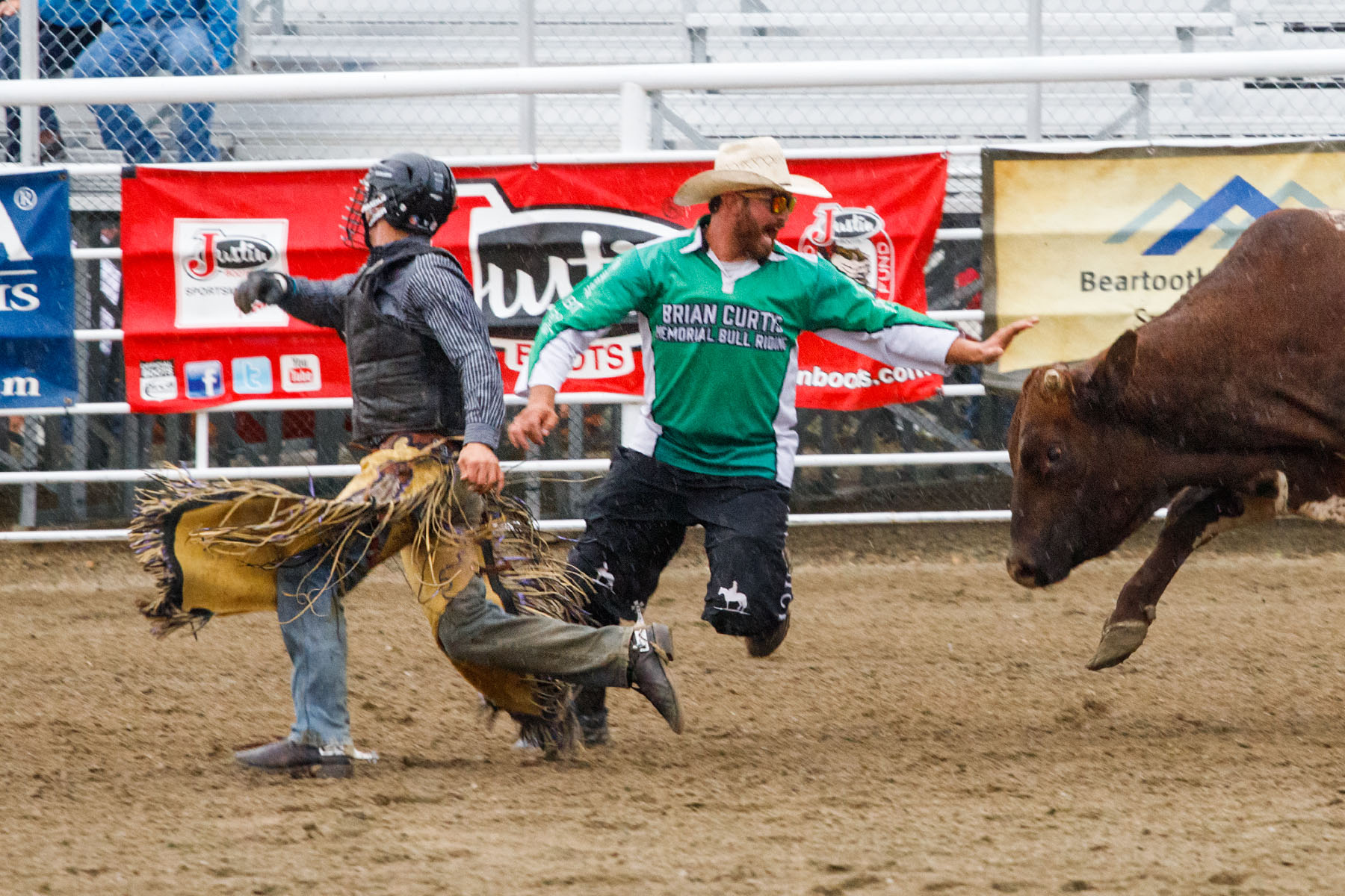 Bullfighter Ezra Coleman steps in, PRCA Xtreme Bulls, Red Lodge, MT.  Click for next photo.