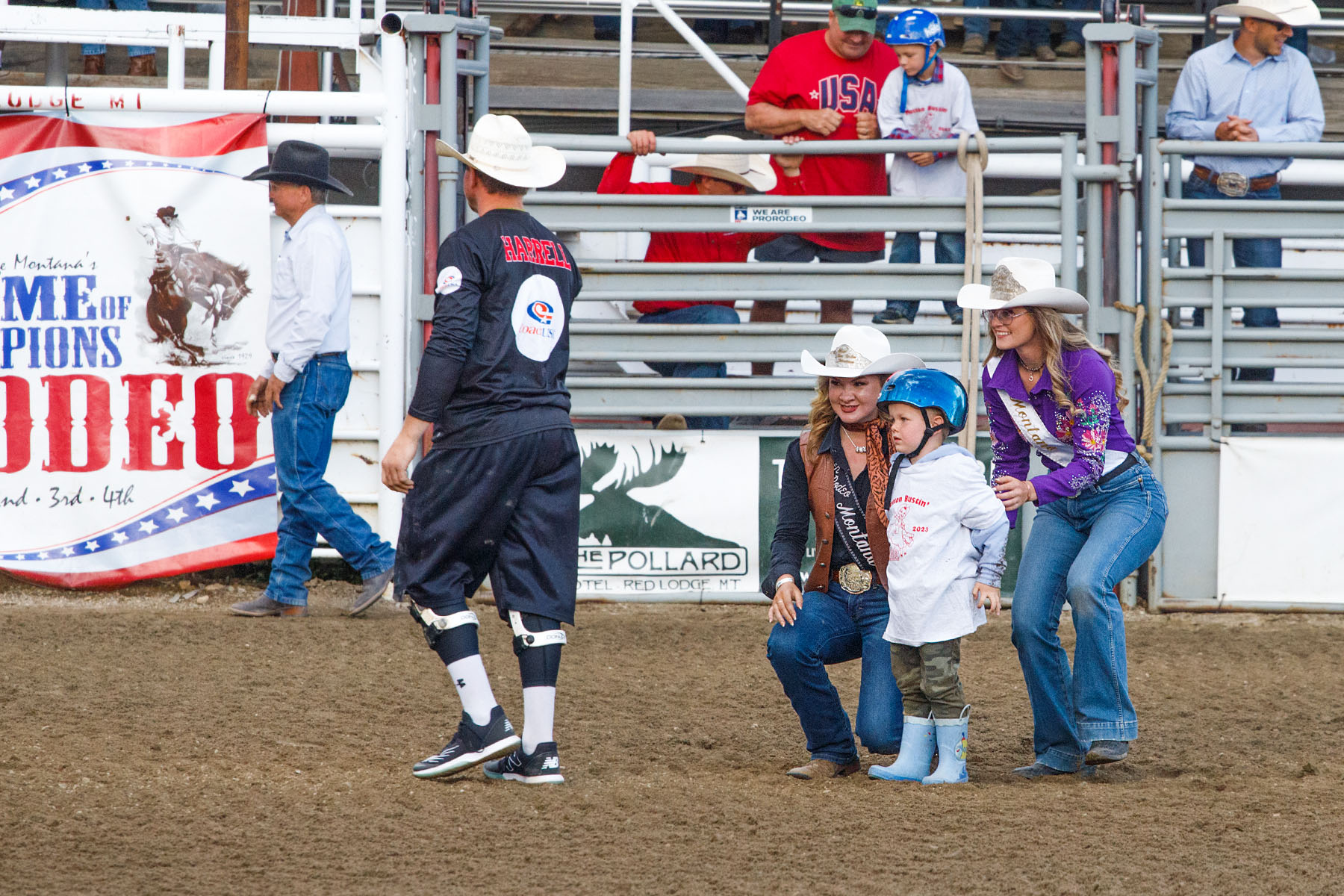 Mutton Busting contestant gets a picture with the rodeo queens, Home of Champions Rodeo, Red Lodge, MT.  Click for next photo.