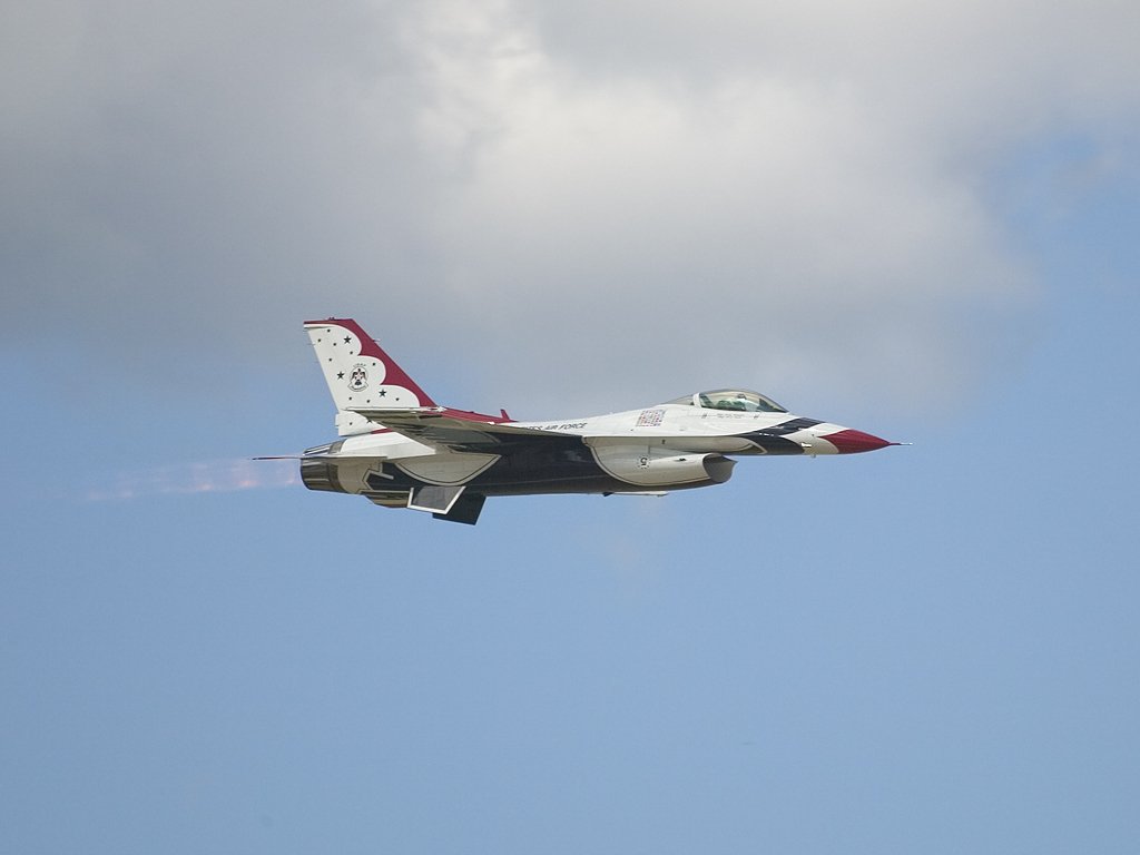 Thunderbird F-16 leaves a trail of fire.  Click for next photo.