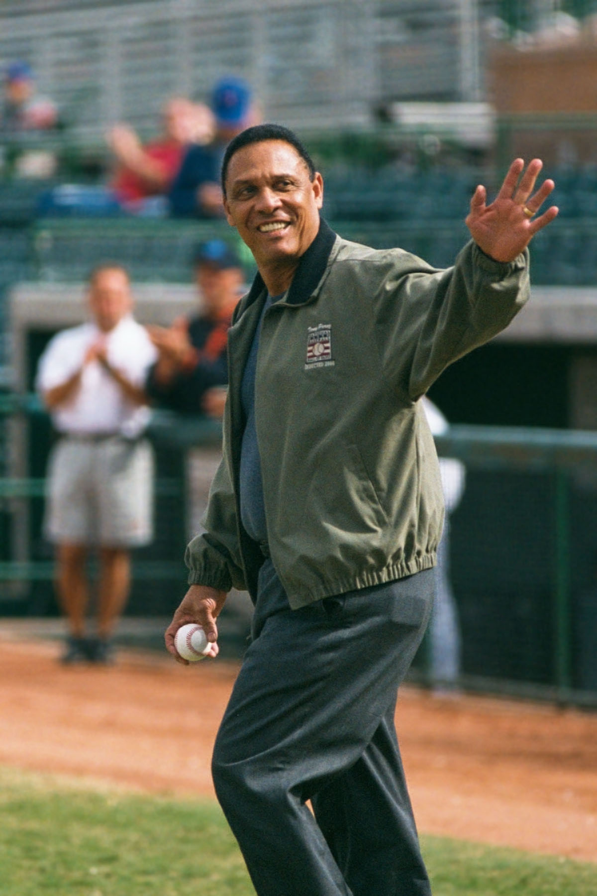 Tony Perez in his new Hall of Fame jacket throws out the first pitch at an Arizona Fall League game, 2000.  Click for next photo.