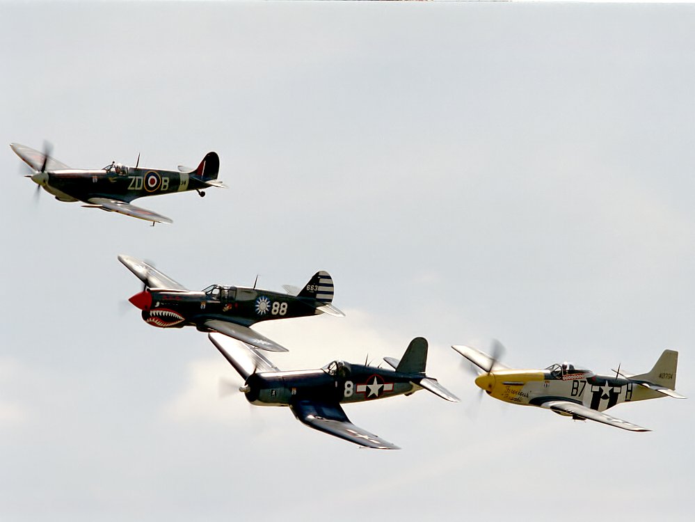 The Breitling Fighters (Spitfire, P-40 Flying Tiger, Corsair, and P-51D Mustang).  Click for next photo.