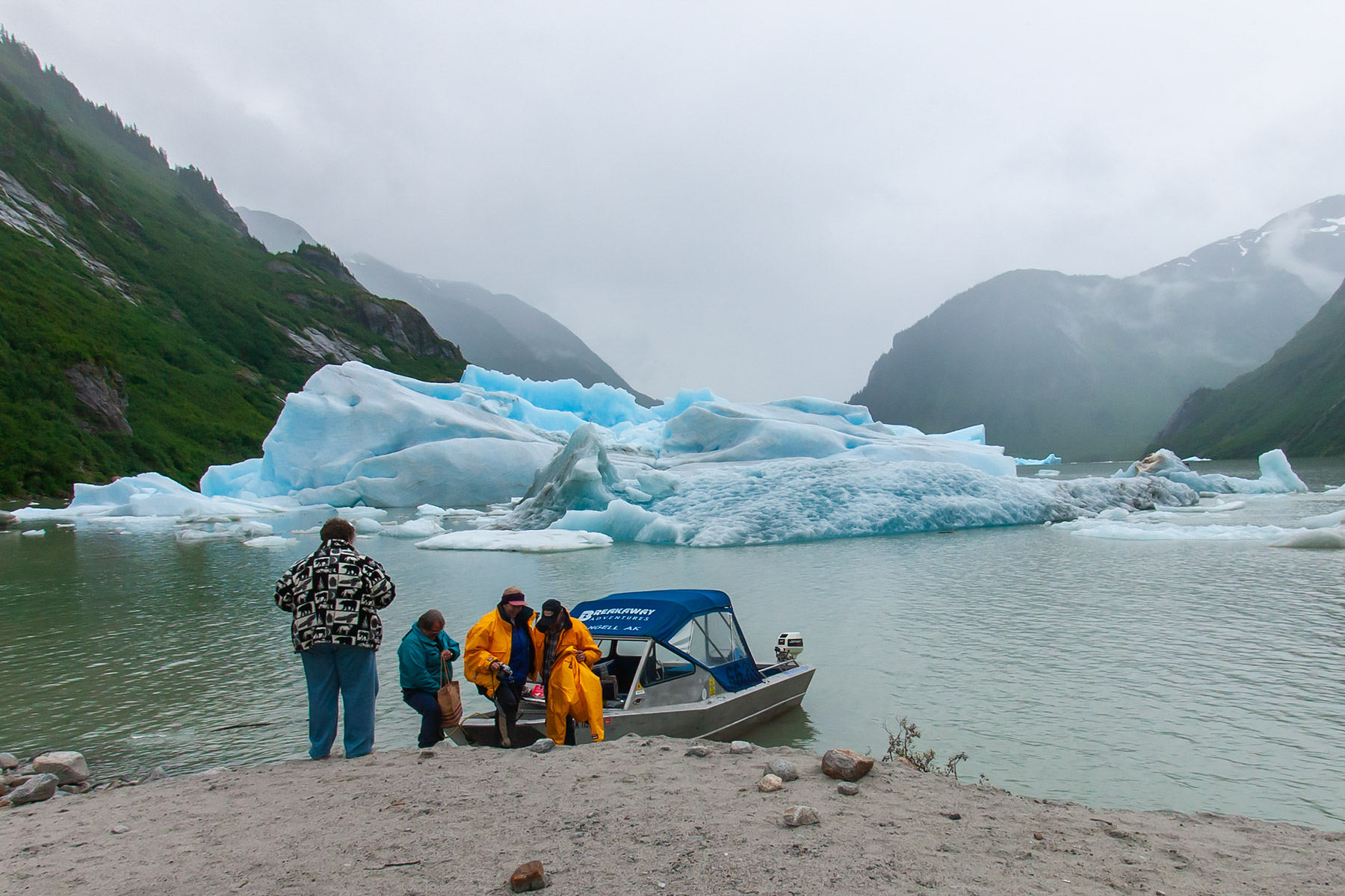 Our little group makes a landing in the Stikine River, Alaska, after getting past that big iceberg.  Click for next photo.