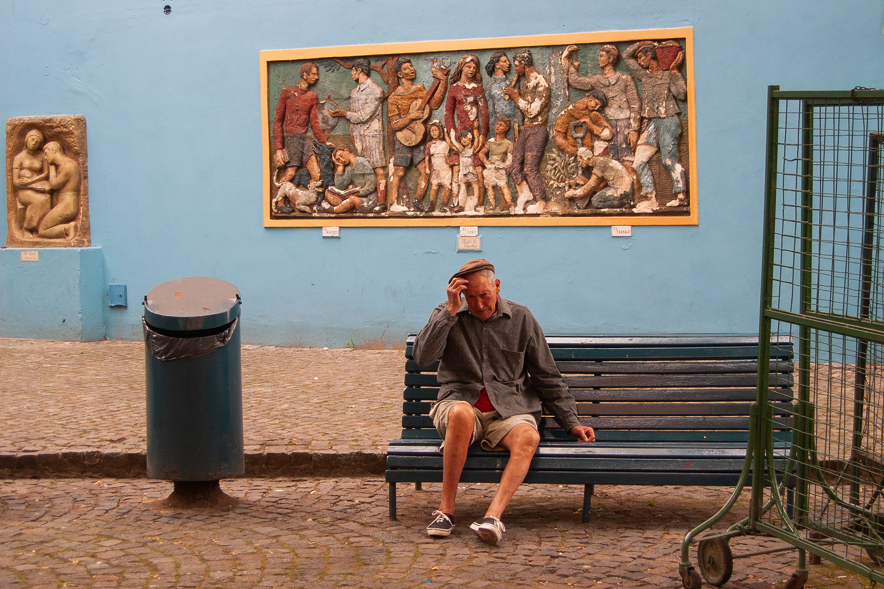 An old man finds a bench, La Boca, Buenos Aires.  Click for next photo.