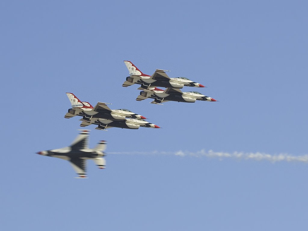 Thunderbirds diamond meets solo flyer, Aviation Nation in Las Vegas.  Click for next photo.