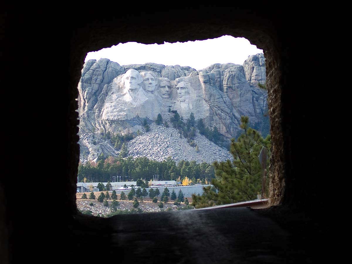 Mt. Rushmore framed by a tunnel on the Iron Mountain Road.    Click for next photo.