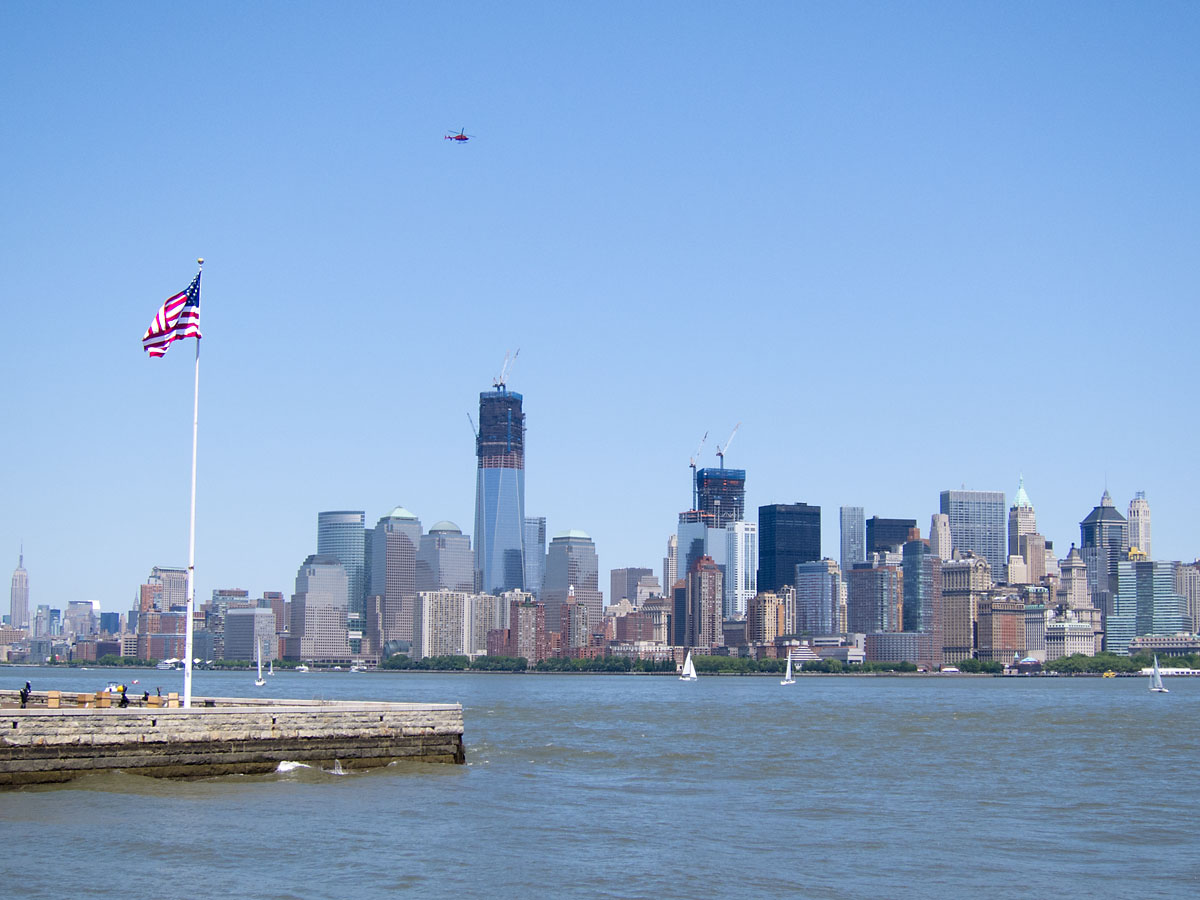 Flag on Ellis Island looking toward lower Manhattan, New York.  Click for next photo.