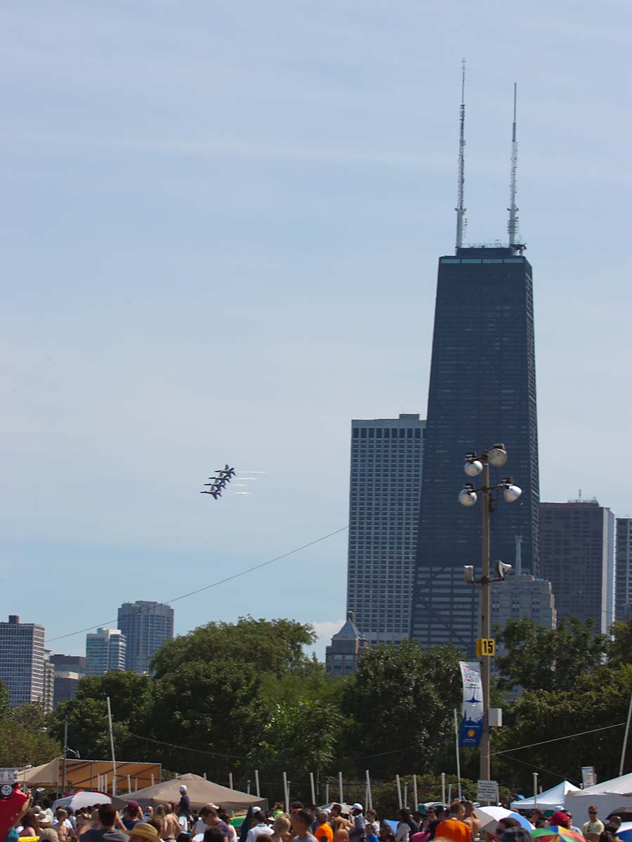 Blue Angels coming around the Hancock Tower, Chicago Air and Water Show.  Click for next photo.