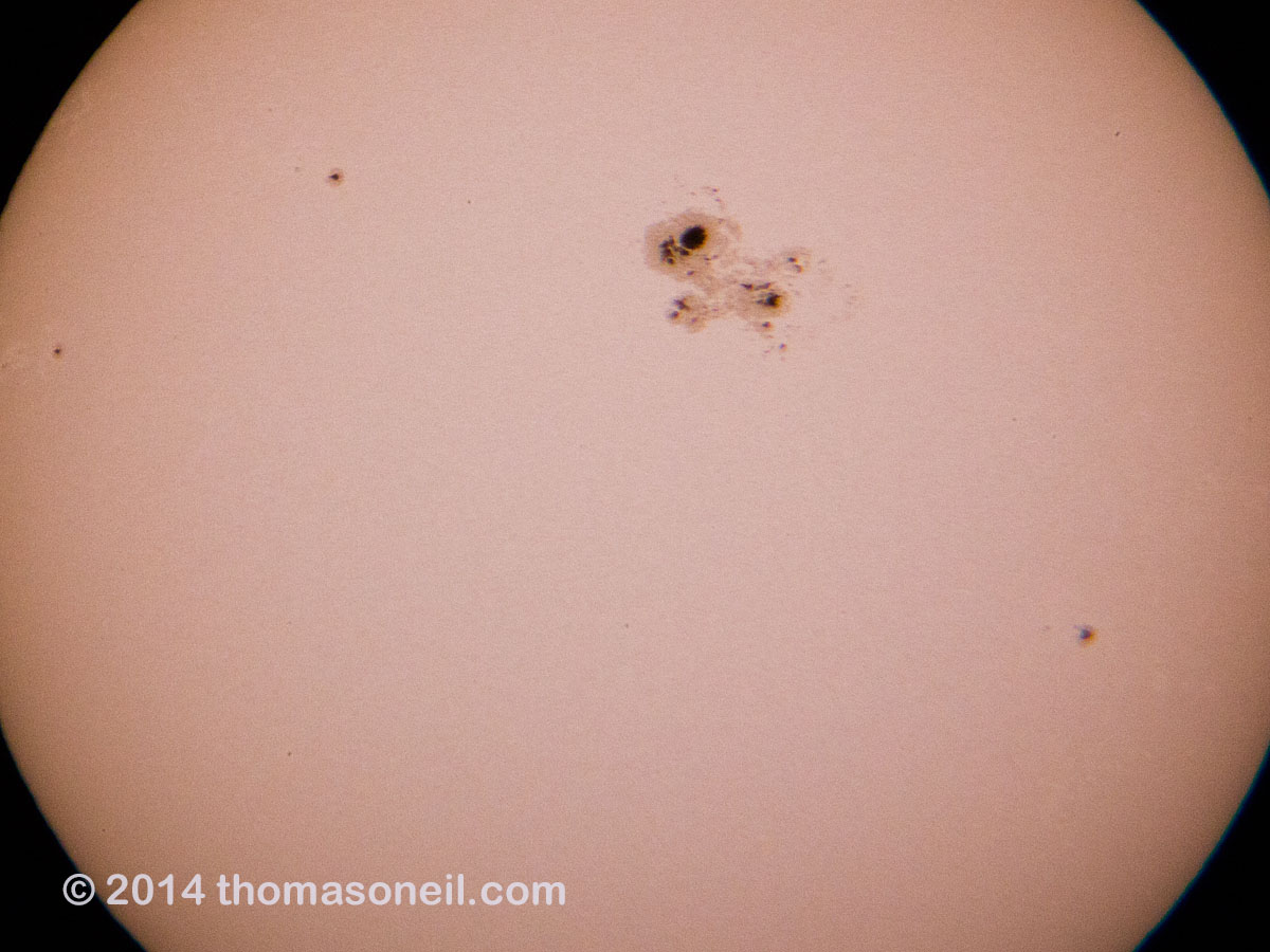 Big sunspot just before the start of a partial solar eclipse, October 23, 2014.  Click for next photo.