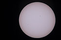 A bad image of the Transit of Mercury, May 9, 2016, shot with the old G6 camera through Televue 85 telescope.  Mercury is the dot toward the lower left.  The day was mostly cloudy/hazy and I was surprised to get anything at all.  For some of my better sun images, see the Partial Eclipse from 2014, the Transit of Venus from 2004, or the Annual Eclipse as seen from Iceland in 2003.