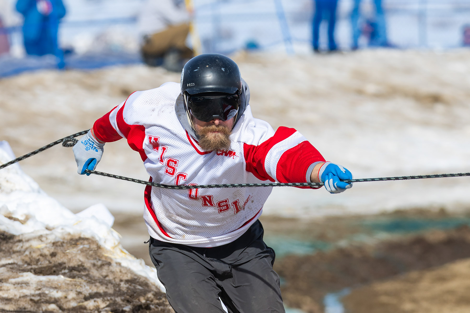 The skiers pull on the rope to shorten it as they get near the end, Ski Joring National Finals.  Click for next photo.