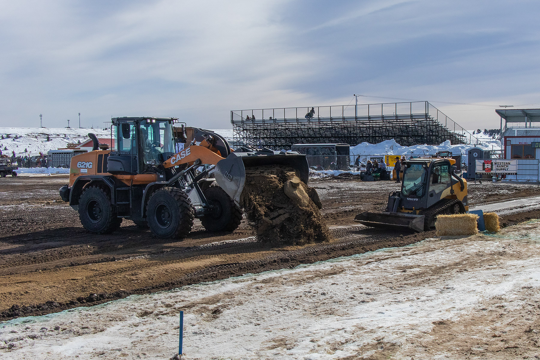 Halftime show, fixing a wet spot on the horse track, Ski Joring National Finals.  Click for next photo.
