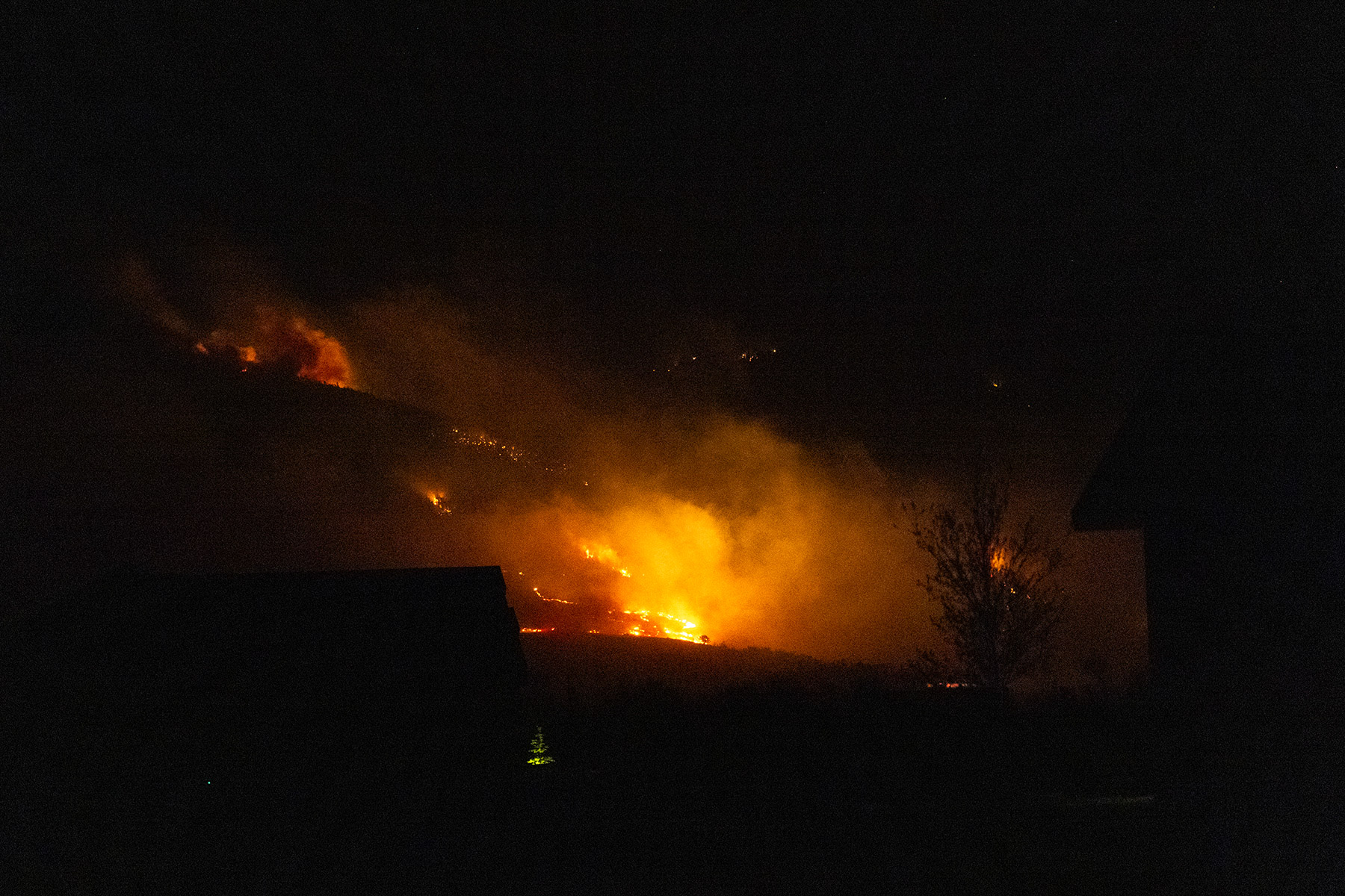 Glow from the East Side Fire can been seen from our house the evening after it started.  Click for next photo.